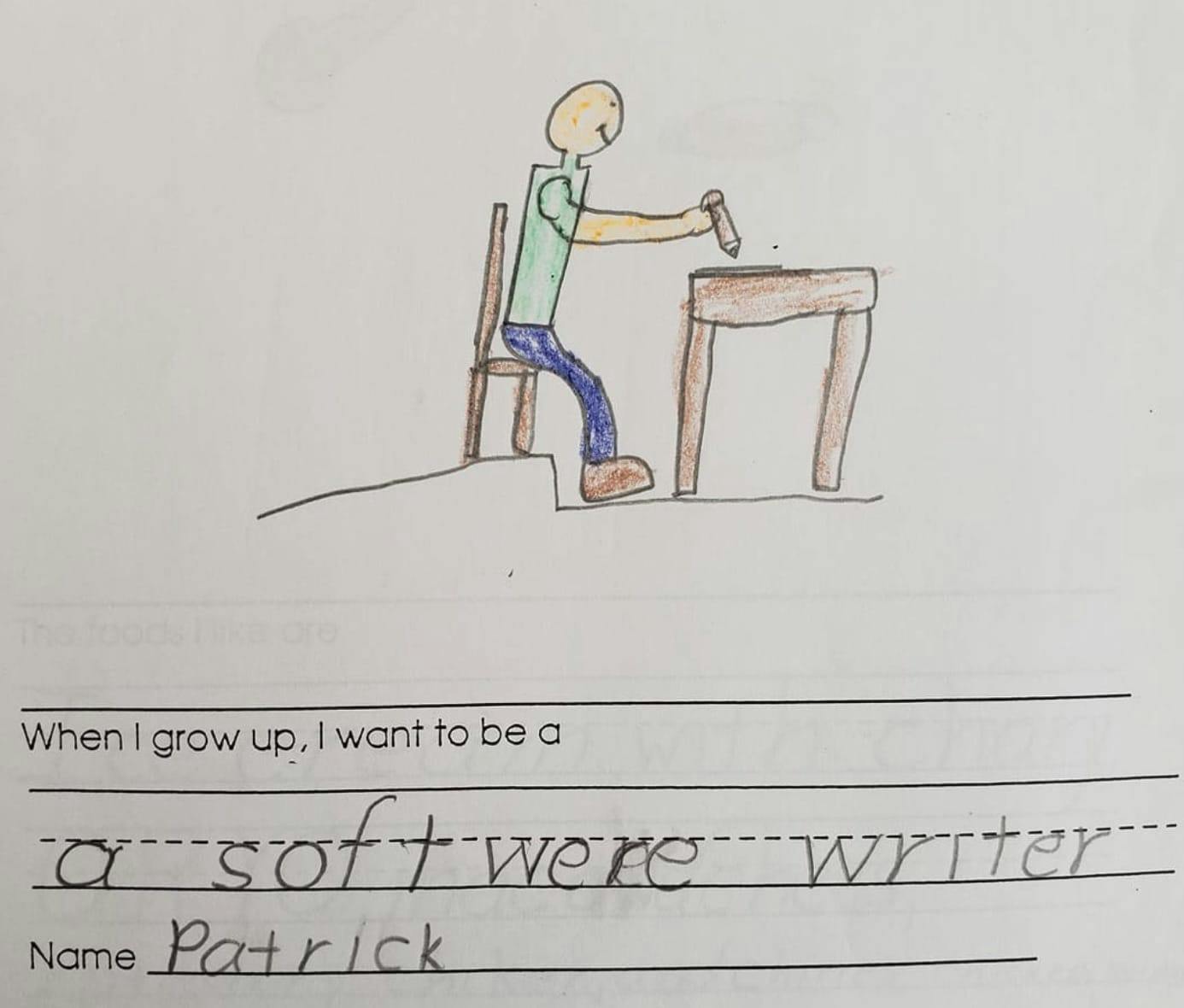 child's drawing of a person at a desk with the caption "When I grow up I want to be a softwere writer"